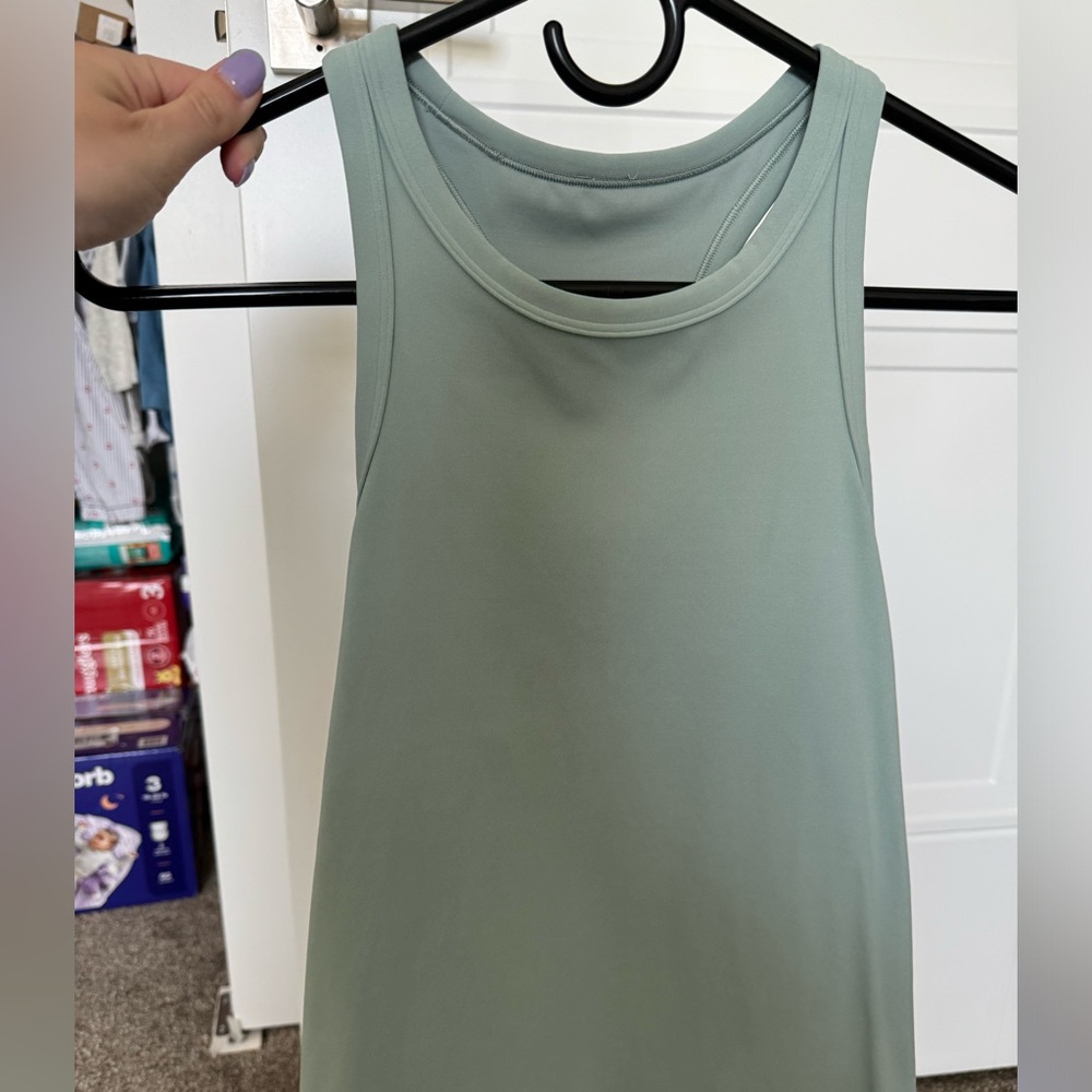Blue/green lululemon tank size 6 kinda cropped. Never worn